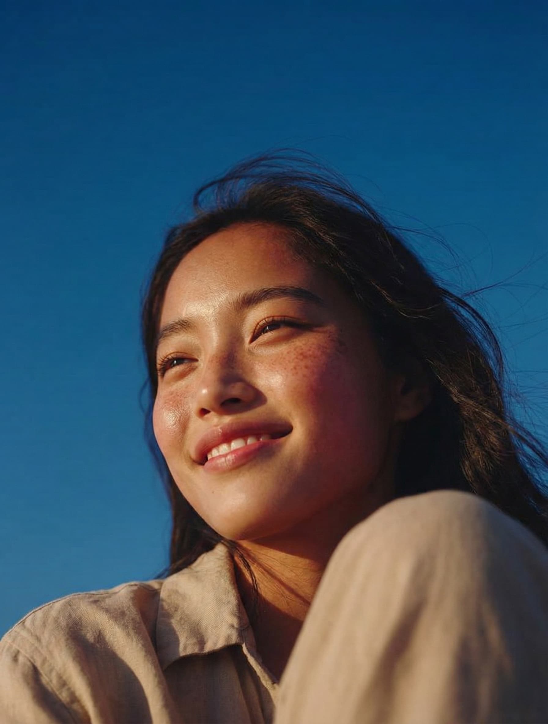 Woman smiling in sunlight